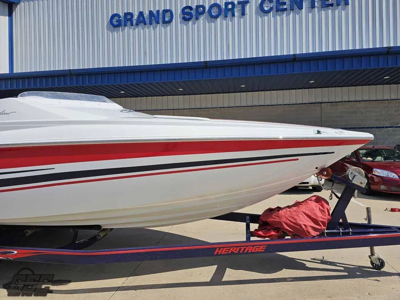 Slide: The Image of 2008 Baja 23 Outlaw boat on trailer at Grand Sport Center. - 13