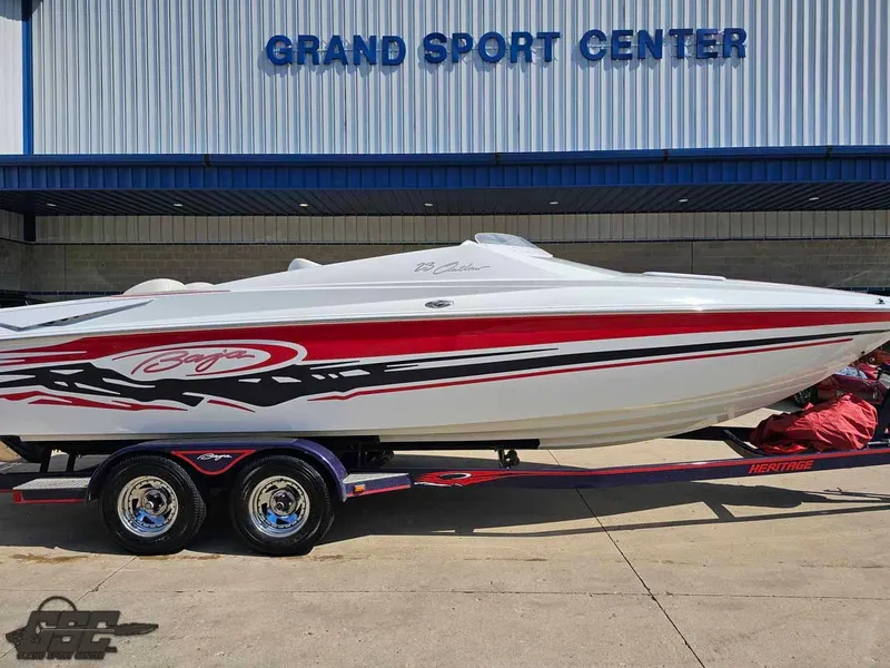 Slide: The Image of 2008 Baja 23 Outlaw boat on trailer at Grand Sport Center. - 3