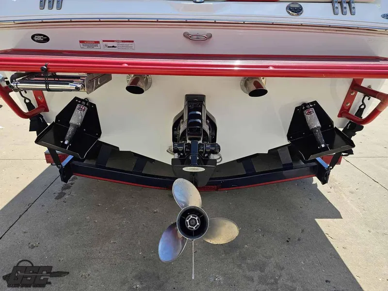 Slide: The Image of Rear view of a 2008 Baja 23 Outlaw boat with visible propeller and exhaust. - 38
