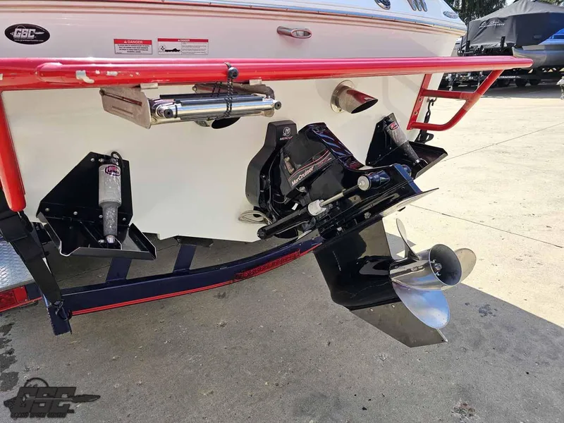 Slide: The Image of 2008 Baja 23 Outlaw boat stern with dual propellers and red railing. - 40