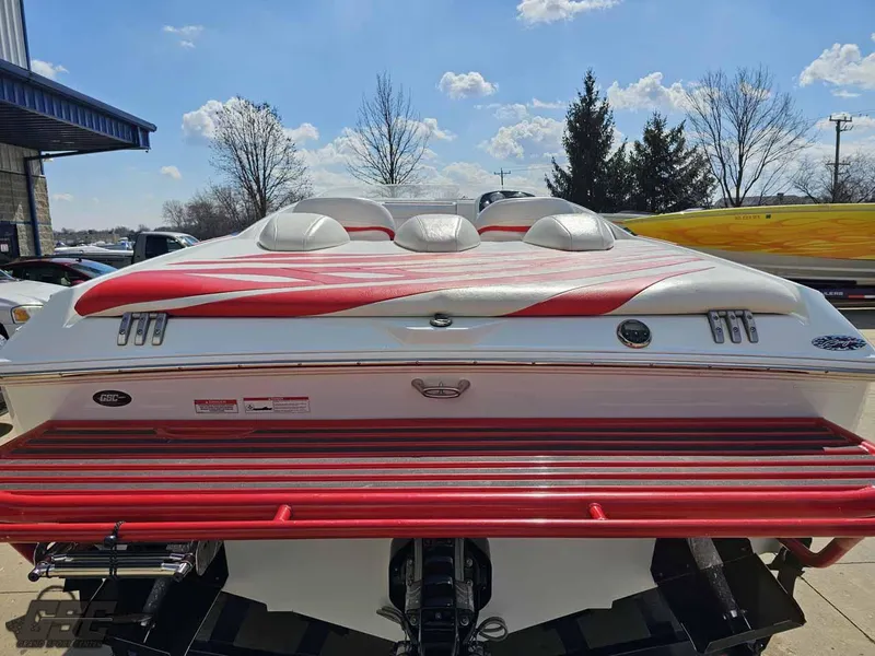 Slide: The Image of 2008 Baja 23 Outlaw boat with red and white design, rear view. - 43