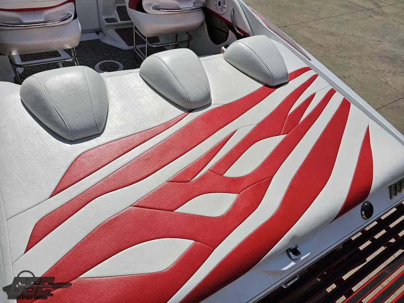 Slide: The Image of 2008 Baja 23 Outlaw boat with red and white upholstery design. - 45