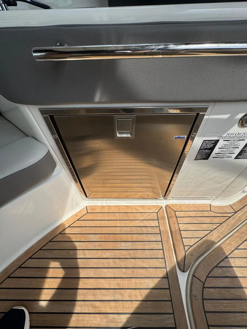 Slide: The Image of 2021 Sea Ray Sundancer 320 OB interior with stainless steel cabinet and teak flooring. - 15