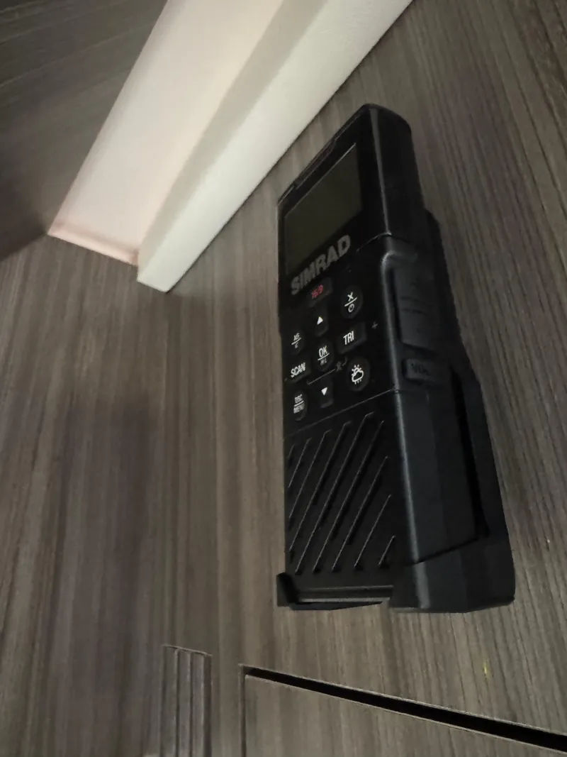 Slide: The Image of Simrad marine radio mounted on a 2021 Sea Ray Sundancer 320 OB yacht interior. - 21