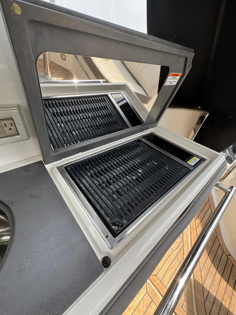 Slide: The Image of 2021 Sea Ray Sundancer 320 OB grill and sink on deck. - 24