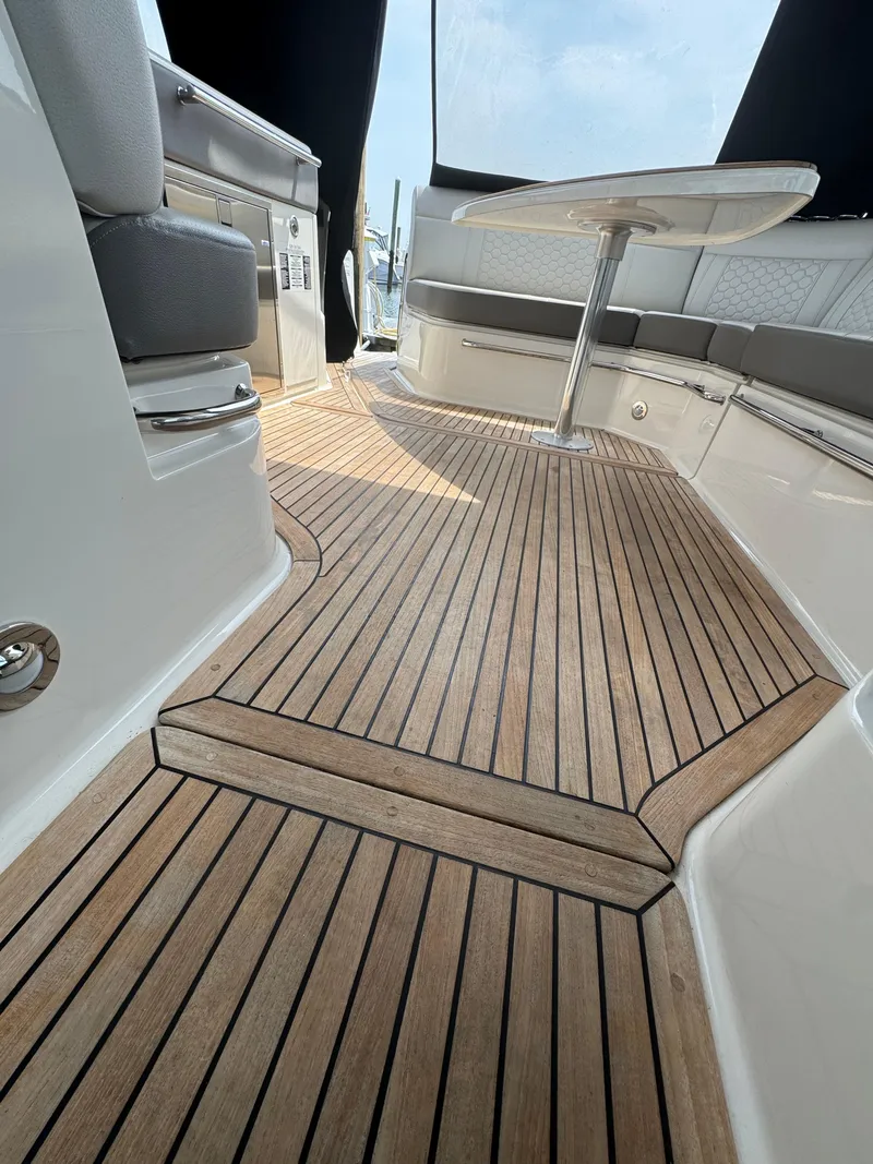 Slide: The Image of 2021 Sea Ray Sundancer 320 OB interior with elegant teak flooring and modern seating. - 26