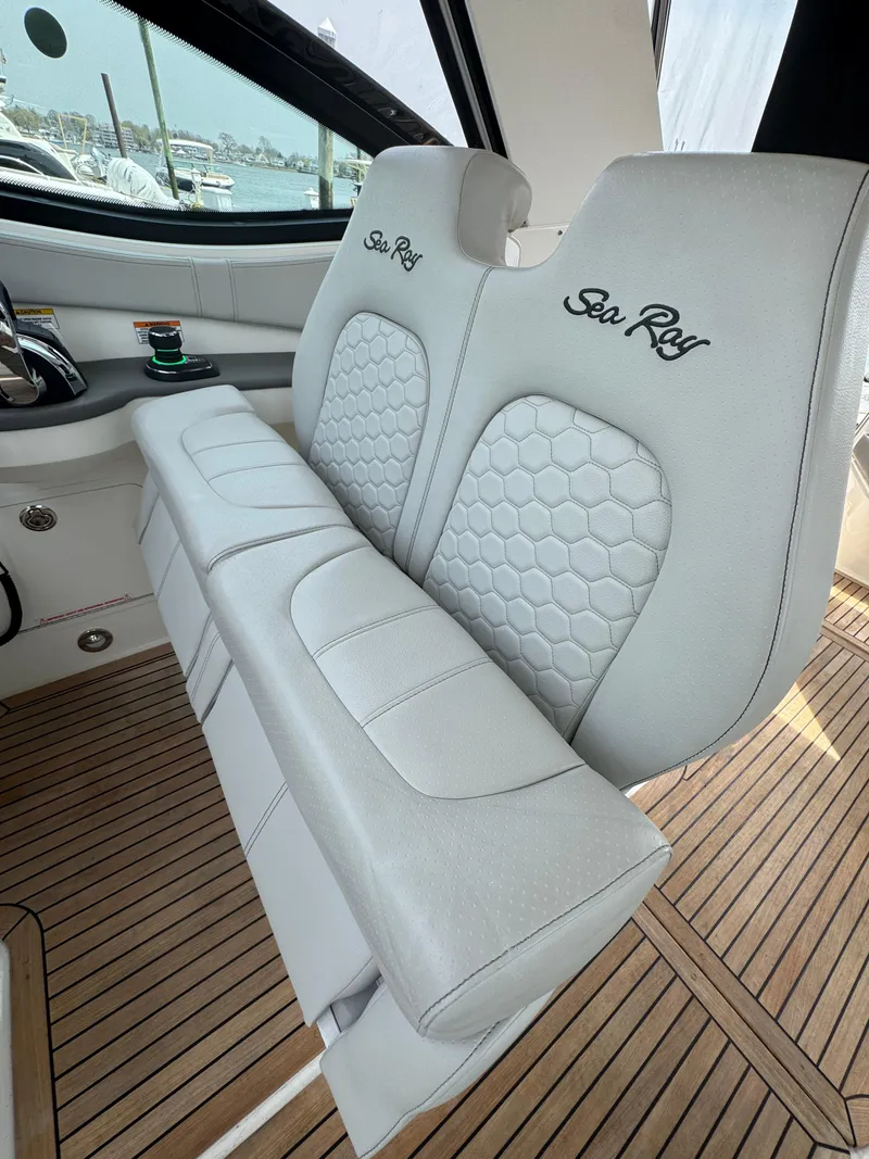 Slide: The Image of Luxury seating on 2021 Sea Ray Sundancer 320 OB with elegant design and wood flooring. - 28