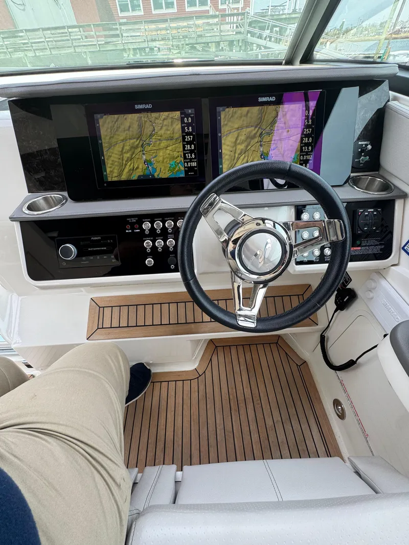 Slide: The Image of Cockpit of 2021 Sea Ray Sundancer 320 OB with advanced navigation displays. - 32
