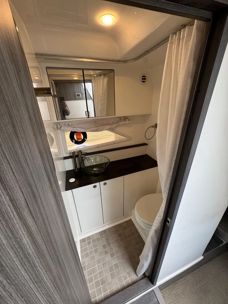 Slide: The Image of 2021 Sea Ray Sundancer 320 OB bathroom with modern fixtures and elegant design. - 35