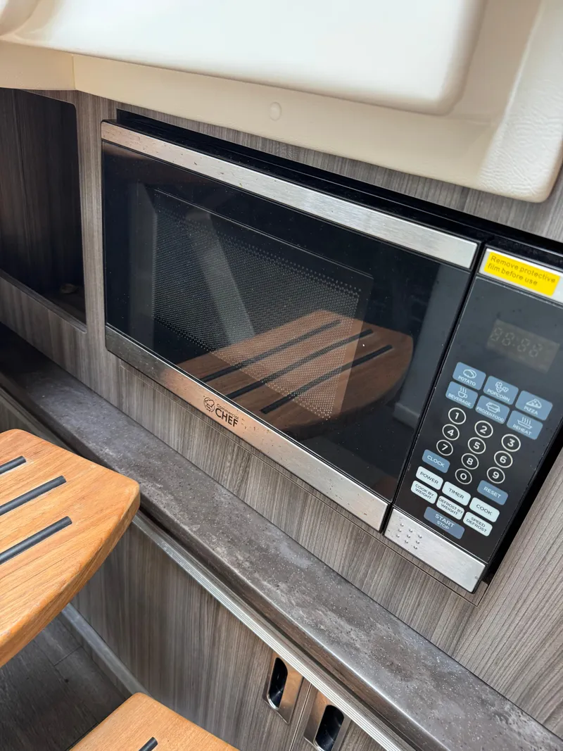 Slide: The Image of 2021 Sea Ray Sundancer 320 OB interior with built-in microwave. - 38