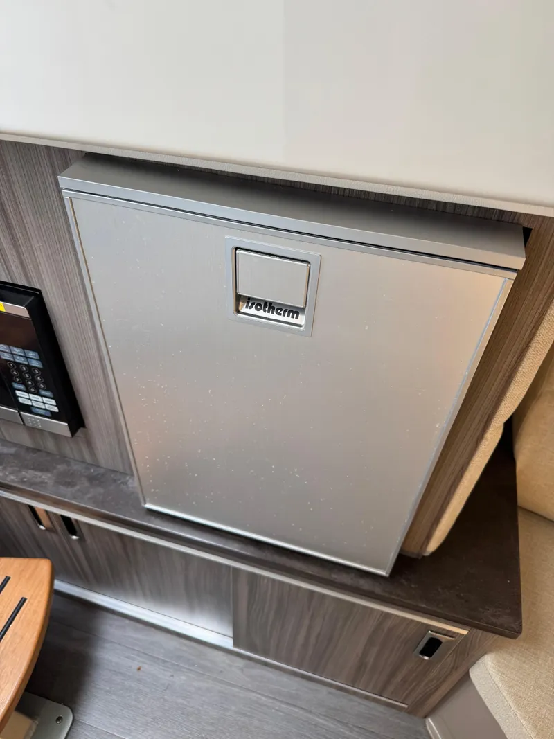 Slide: The Image of 2021 Sea Ray Sundancer 320 OB interior with a built-in Vitrifrigo refrigerator. - 40