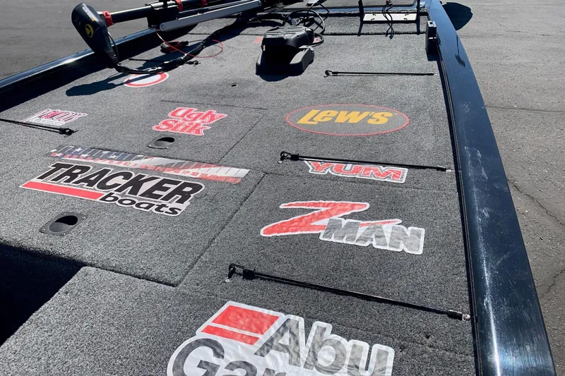 Slide: The Image of 2024 Tracker PRO170 boat deck with various fishing brand logos. - 3