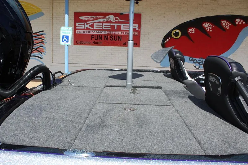 Slide: The Image of 2025 Skeeter FXR21L boat deck with seating, displayed at Fun N Sun dealership. - 12