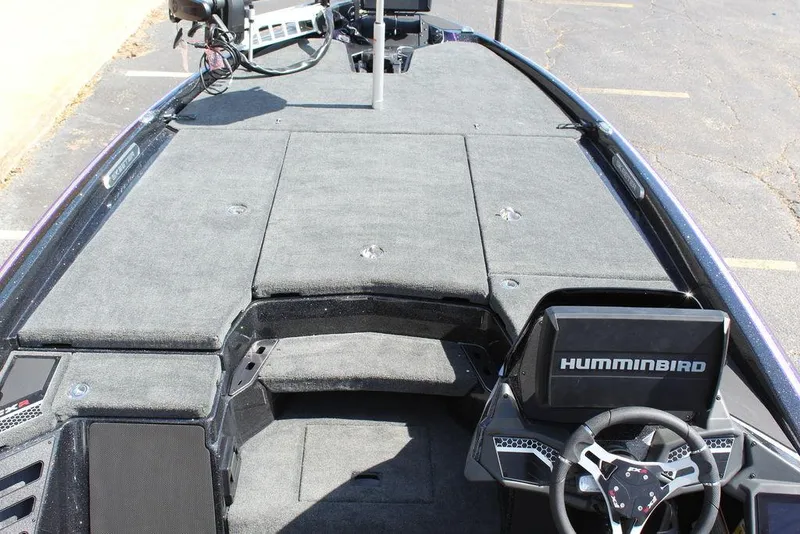 Slide: The Image of 2025 Skeeter FXR21L boat interior with Humminbird electronics and spacious deck layout. - 19