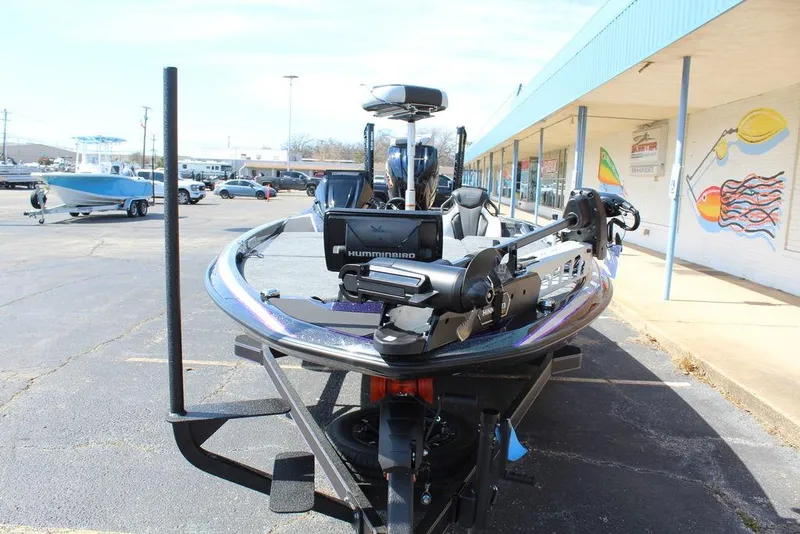 Slide: The Image of 2025 Skeeter FXR21L boat with advanced navigation equipment in a parking lot. - 9