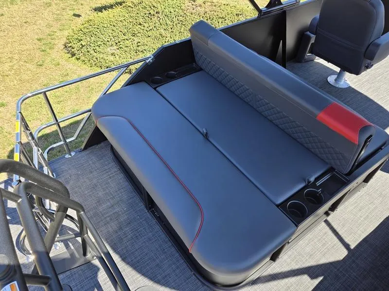 Slide: The Image of 2025 Godfrey Sweetwater 2286 SFLC boat interior with gray seating and cup holders. - 4