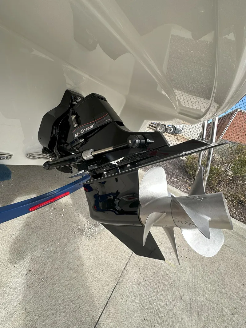 Slide: The Image of 2025 Crownline E235 boat propeller and outdrive close-up. - 15