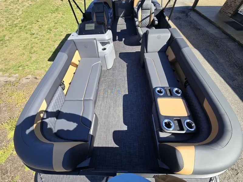 Slide: The Image of 2025 Godfrey Sweetwater 2286 SB pontoon boat interior with spacious seating and cup holders. - 6
