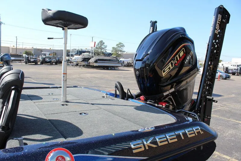 Slide: The Image of 2025 Skeeter ZXR20 boat with SHM engine, parked in a marina. - 12