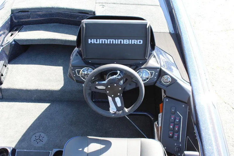 Slide: The Image of 2025 Skeeter ZXR20 boat dashboard with Humminbird display and steering wheel. - 18