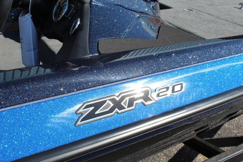 Slide: The Image of 2025 Skeeter ZXR20 boat with sparkling blue finish and logo detail. - 19