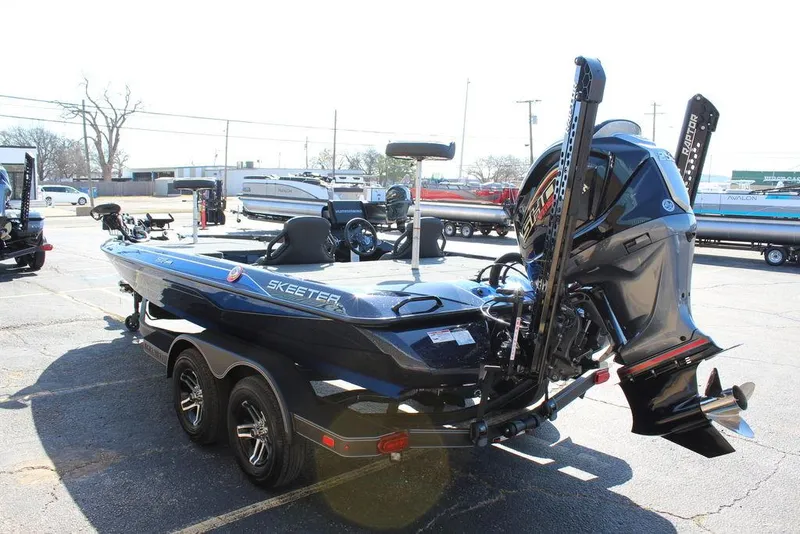 Slide: The Image of 2025 Skeeter ZXR20 boat on trailer, featuring sleek design and powerful outboard motor. - 5