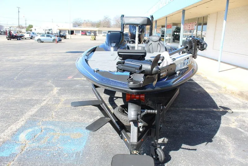 Slide: The Image of 2025 Skeeter ZXR20 boat parked in a lot, showcasing its sleek design and equipment. - 9