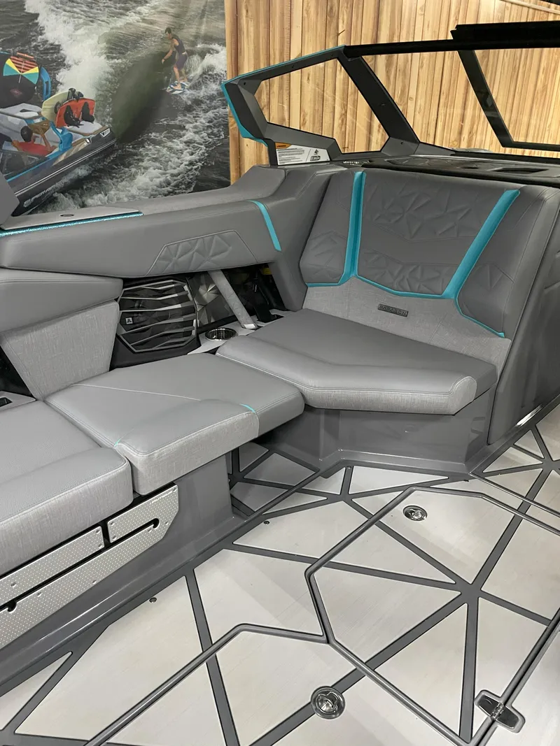 Slide: The Image of 2024 Nautique Super Air Nautique G23 Paragon interior with sleek gray seating and modern design. - 14