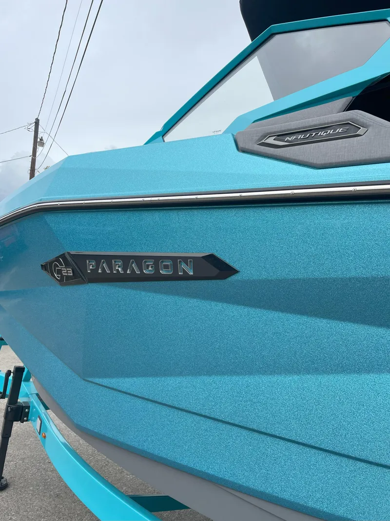 Slide: The Image of 2024 Nautique Super Air Nautique G23 Paragon in blue, showcasing sleek design details. - 4