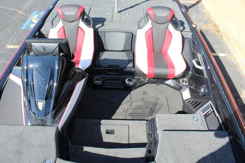 Slide: The Image of 2025 Skeeter FXR21L boat interior with red and black seats, modern design. - 15