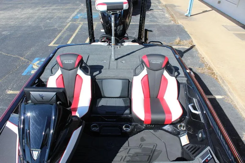 Slide: The Image of 2025 Skeeter FXR21L boat interior with red and black seats, showcasing modern design. - 16