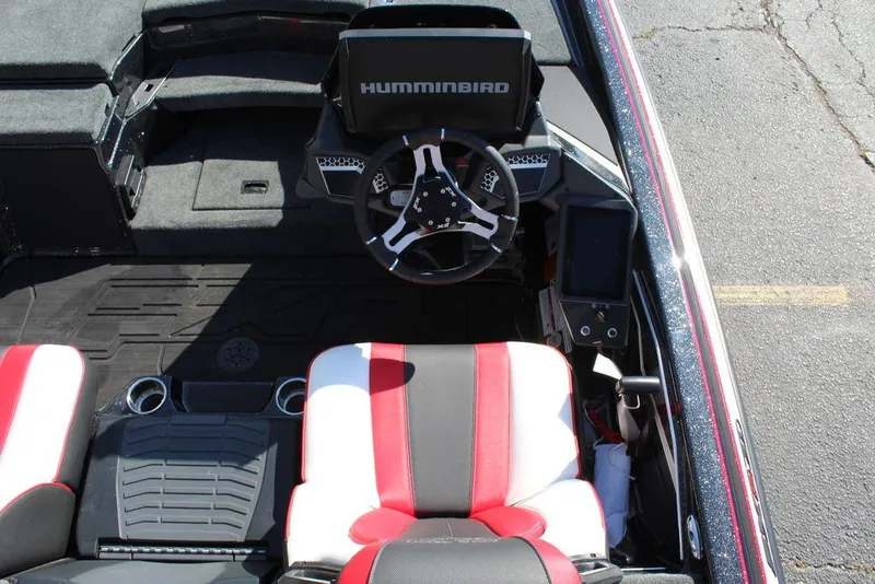Slide: The Image of 2025 Skeeter FXR21L boat interior with Humminbird electronics and red-black seats. - 20