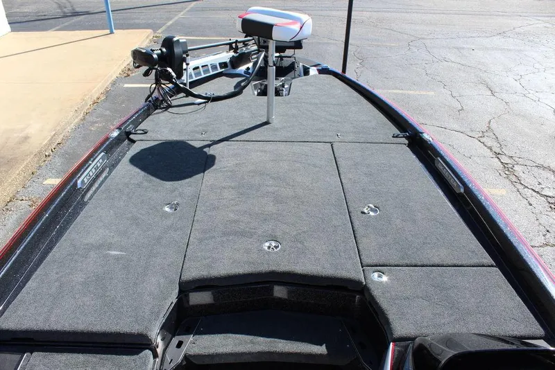 Slide: The Image of 2025 Skeeter FXR21L fishing boat deck with trolling motor, spacious layout. - 21