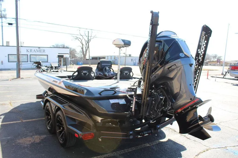 Slide: The Image of 2025 Skeeter FXR21L boat with powerful outboard motor, parked on a trailer. - 7