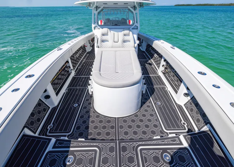 Slide: The Image of Freeman 42 LR 2019 boat with sleek deck design on turquoise water. - 10