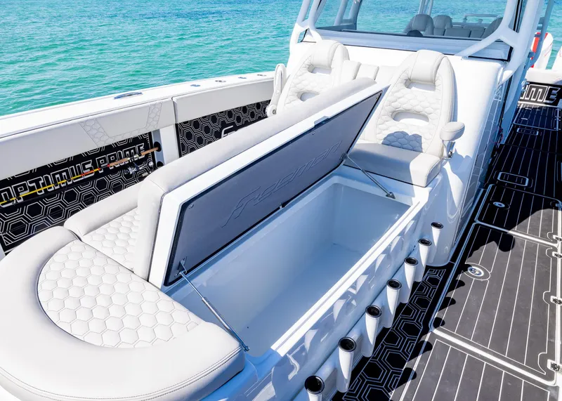 Slide: The Image of Luxury seating and storage on a 2019 Freeman 42 LR boat, with ocean backdrop. - 15