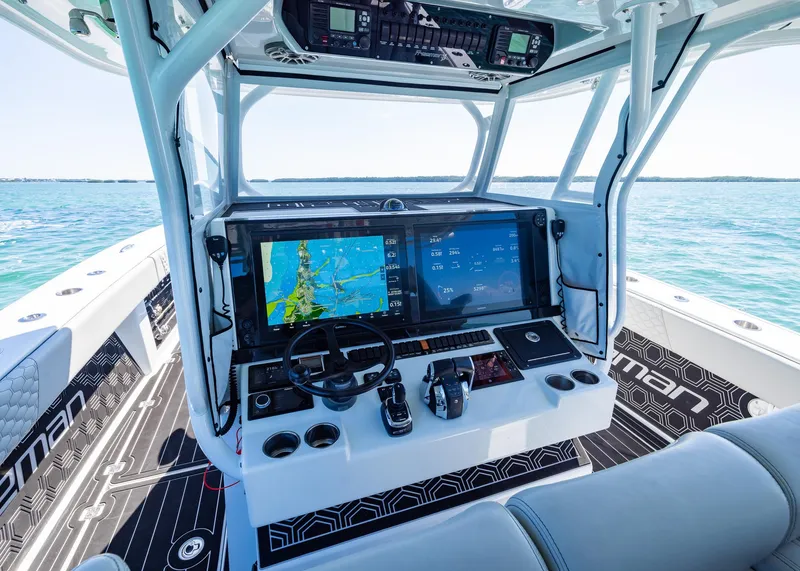 Slide: The Image of Cockpit of 2019 Freeman 42 LR boat with advanced navigation systems on open water. - 16