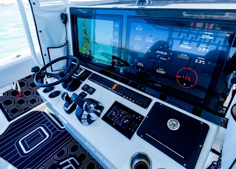 Slide: The Image of Control panel of a 2019 Freeman 42 LR boat with advanced navigation displays. - 18