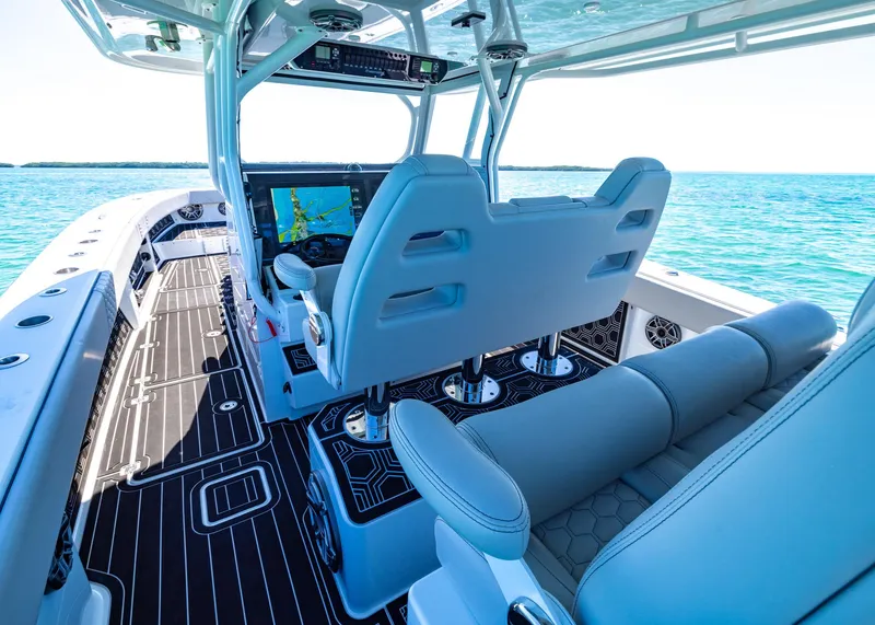 Slide: The Image of 2019 Freeman 42 LR boat interior with modern helm and seating on open water. - 19