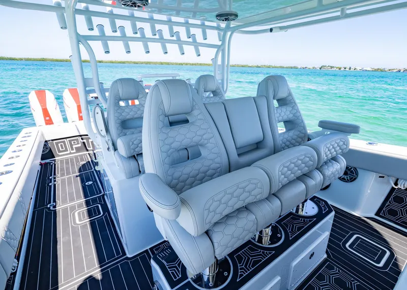 Slide: The Image of Luxurious seating on a 2019 Freeman 42 LR boat, with ocean backdrop. - 20