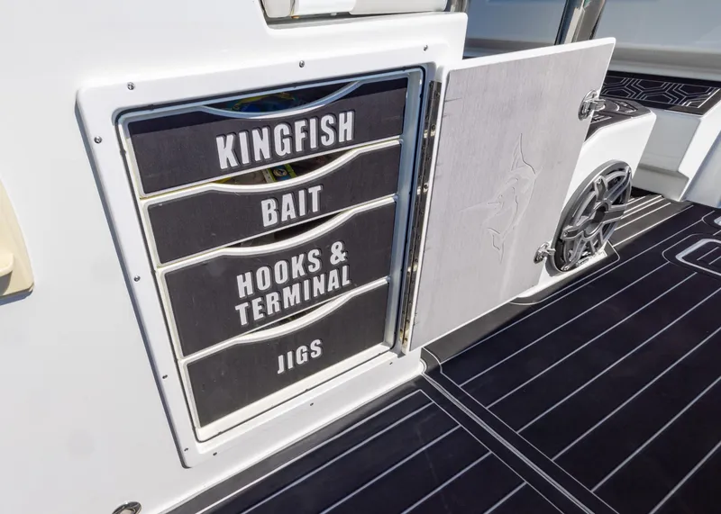 Slide: The Image of Freeman 42 LR 2019 boat storage compartments labeled for fishing gear. - 21