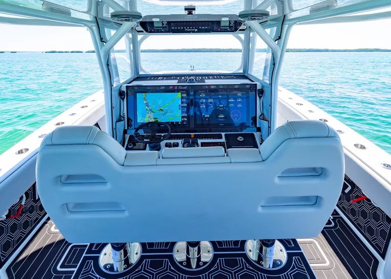 Slide: The Image of 2019 Freeman 42 LR boat cockpit with advanced navigation system on open water. - 23