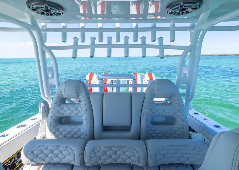Slide: The Image of Luxurious seating on a 2019 Freeman 42 LR boat with ocean backdrop. - 24
