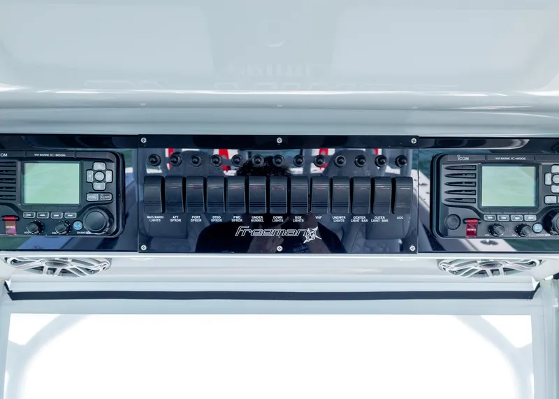 Slide: The Image of Control panel of a 2019 Freeman 42 LR boat with electronic displays and switches. - 25