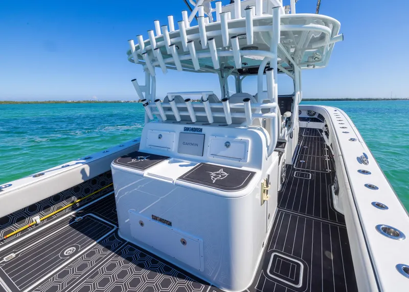 Slide: The Image of 2019 Freeman 42 LR boat on water, featuring sleek design and spacious deck. - 27