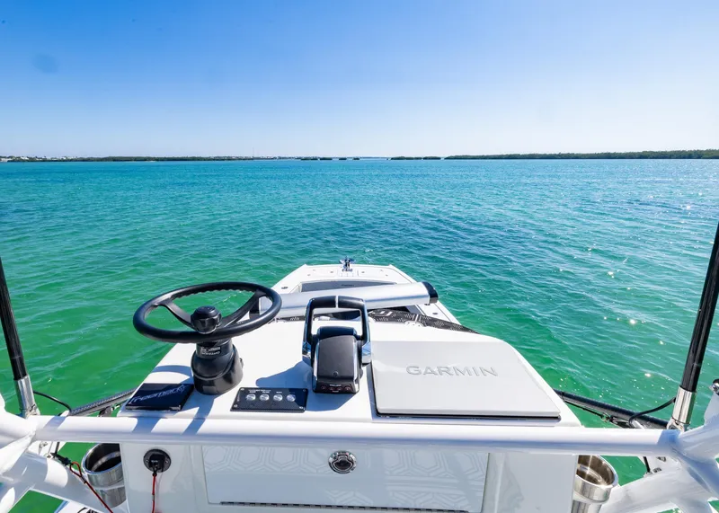 Slide: The Image of 2019 Freeman 42 LR boat helm with Garmin system on turquoise water. - 29