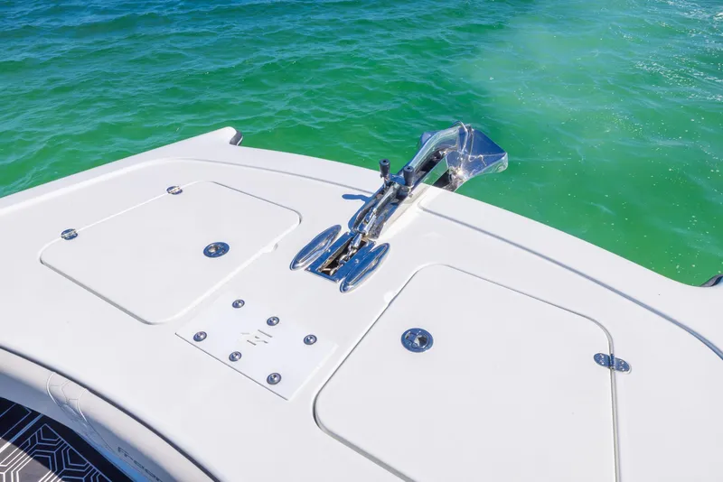 Slide: The Image of Bow of 2019 Freeman 42 LR boat on clear turquoise water. - 3