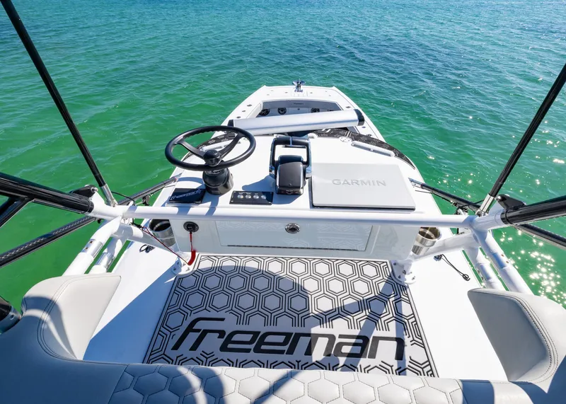 Slide: The Image of Freeman 42 LR 2019 boat helm with Garmin system on turquoise water. - 30