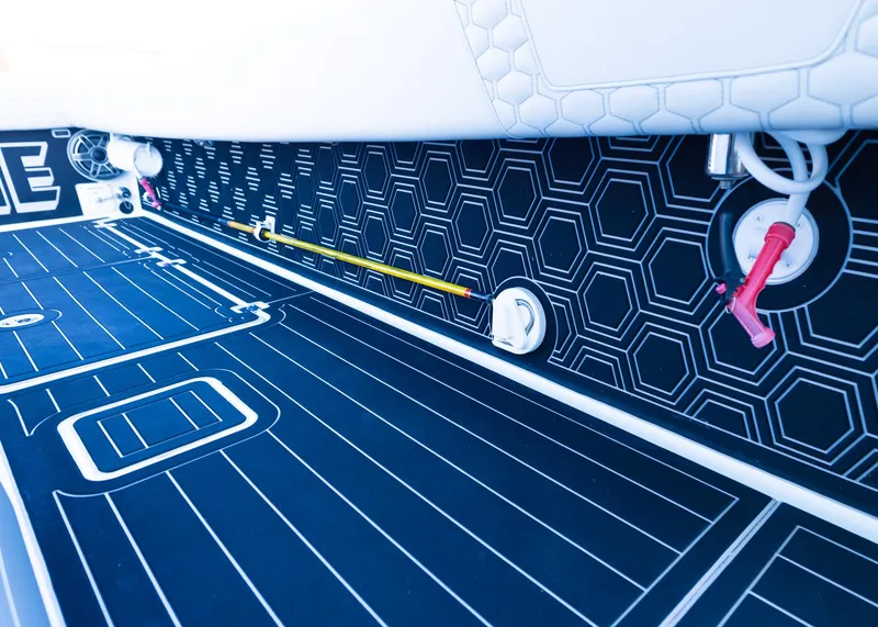 Slide: The Image of Interior view of a 2019 Freeman 42 LR boat with hexagonal patterned flooring. - 35