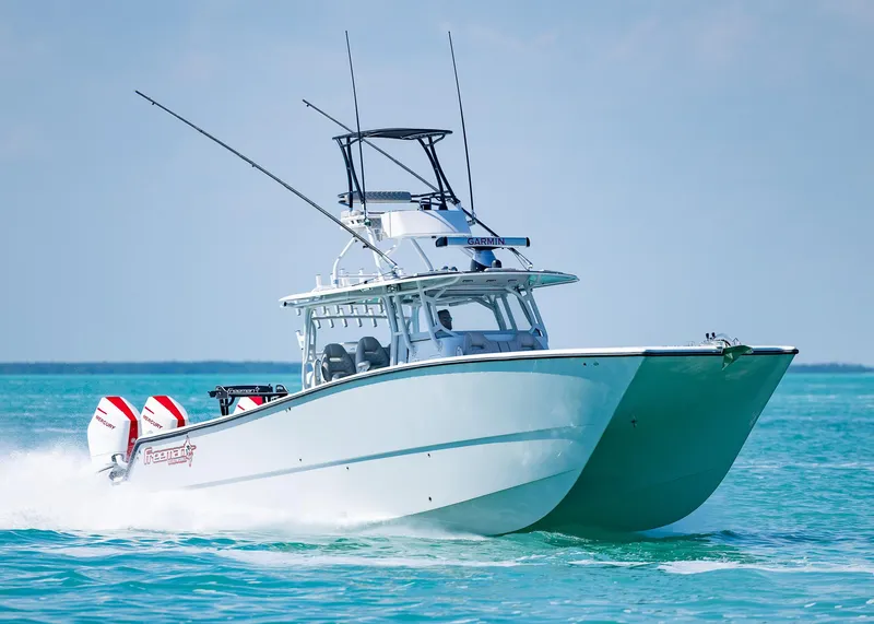 Slide: The Image of 2019 Freeman 42 LR boat cruising on clear blue water. - 46